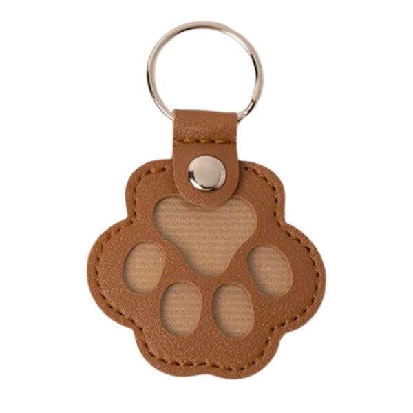<strong>Guau!</strong> Llavero Guardapelos en Forma de Patita, Color Café